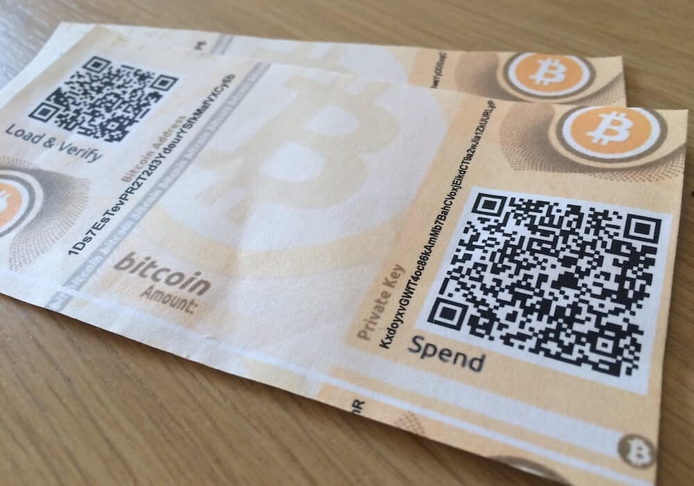 Uma nota de papel do Bitcoin (alusão às carteiras de papel)
